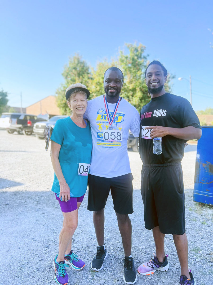 Runners posing for photo at Path to Positivity 5K Run
